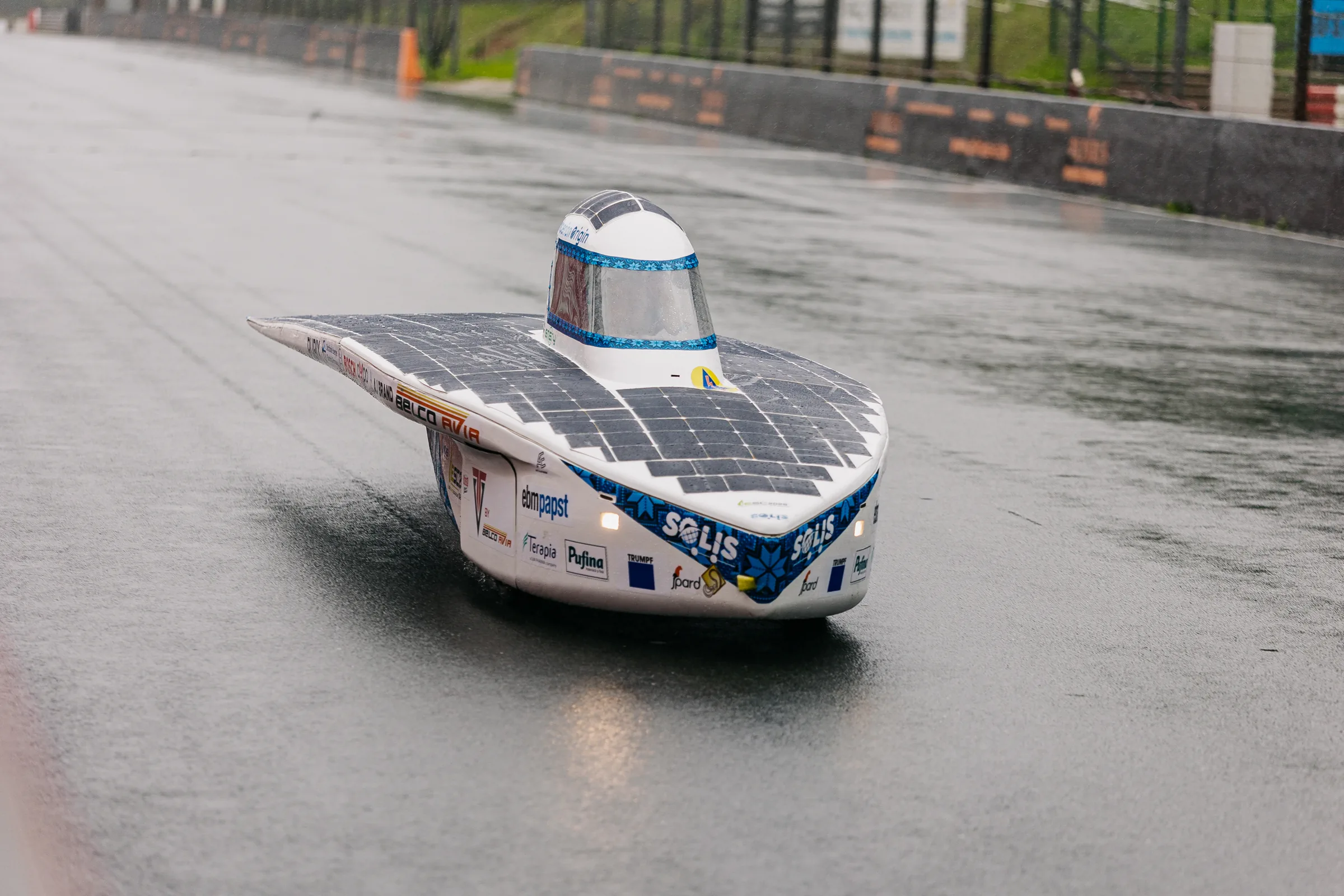 Hyperion Origin alone on the soaked main straight in the rain.