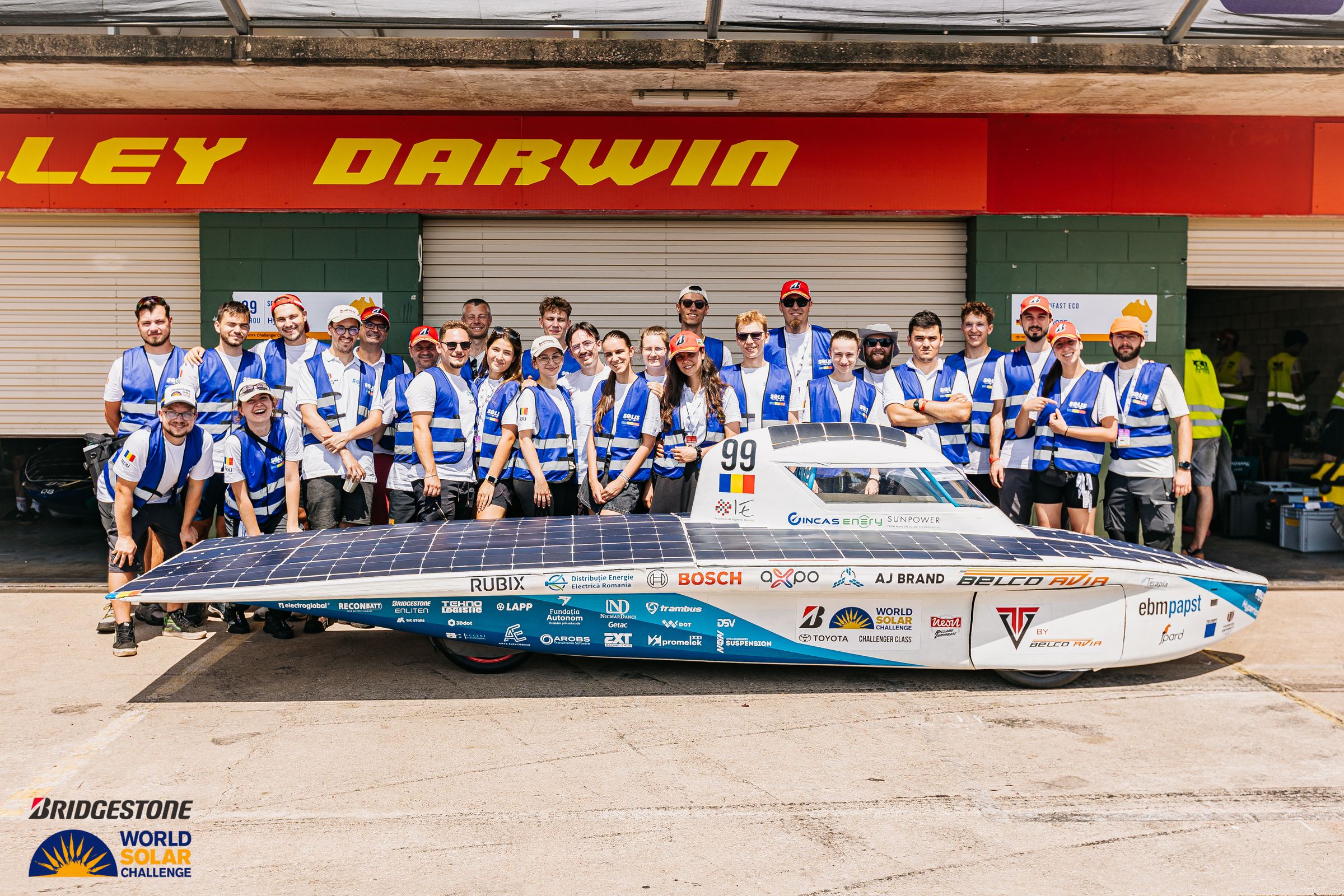The Solis team with Hyperion in front of the garages at Hidden Valley, Darwin, in 2025.